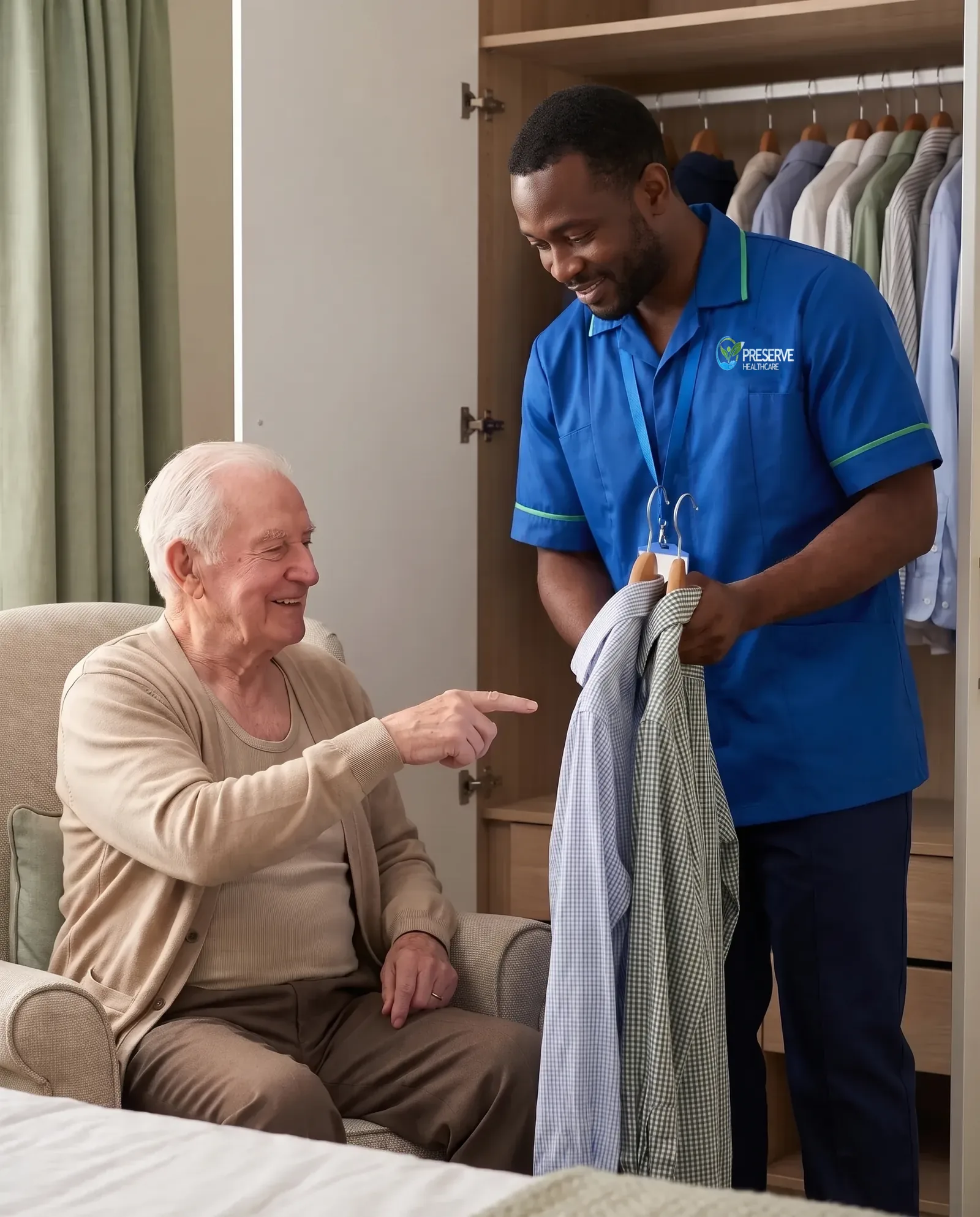 Carer offering an elderly man a choice of shirts while helping him get dressed with dignity